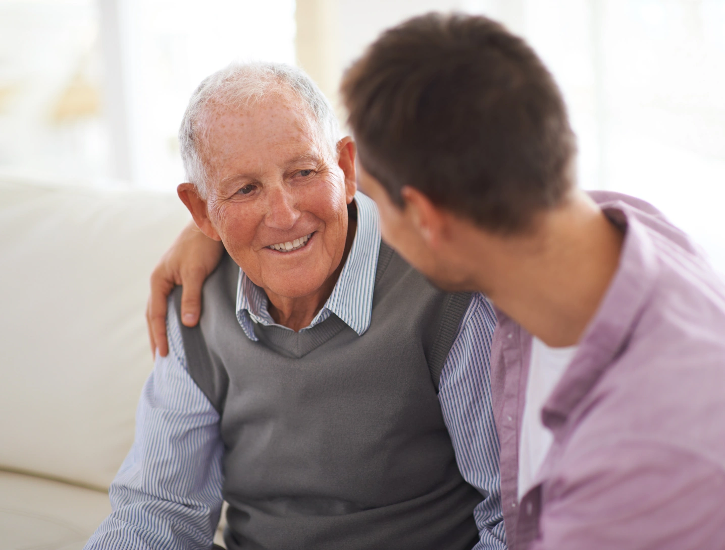 Home Care Lemon Grove happy elderly male has chat with male caretaker
