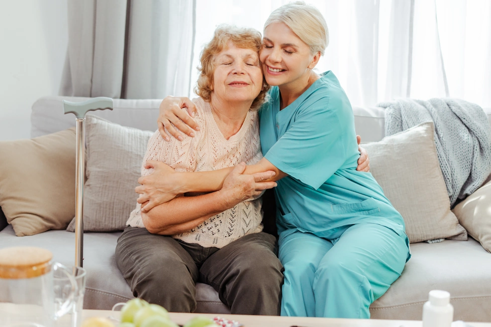 Winter Gardens CA Home Care compassionate caretaker hugs happy elderly woman